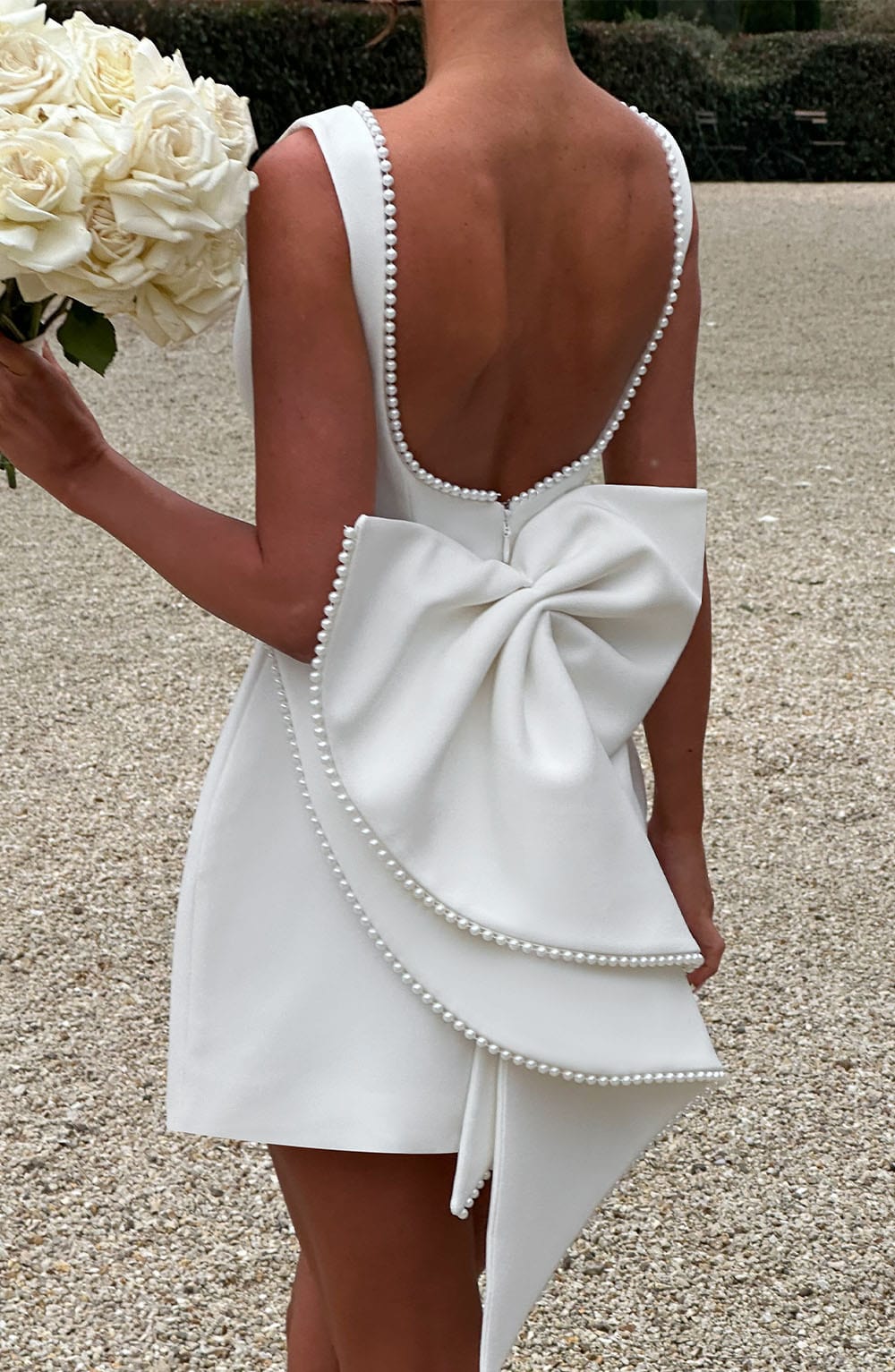 Elegant Pearl Trim Mini Dress for Women with Bateau Neck Sleeveless Bow Back Fit and Flare Cocktail Style