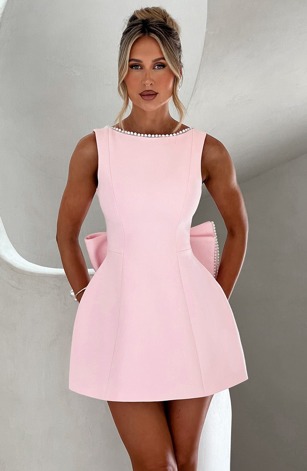 Elegant Pearl Trim Mini Dress for Women with Bateau Neck Sleeveless Bow Back Fit and Flare Cocktail Style