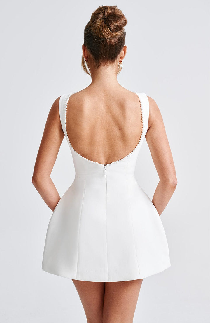 Elegant Pearl Trim Mini Dress for Women with Bateau Neck Sleeveless Bow Back Fit and Flare Cocktail Style