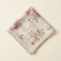 Giulia floral print square scarf in rose and sage, folded on a cream studio backdrop